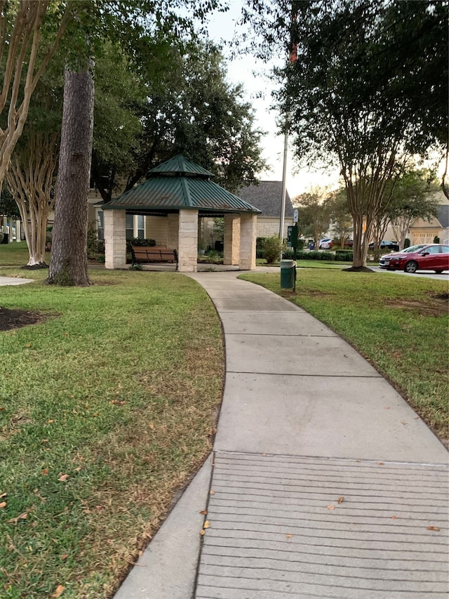 surrounding community featuring a gazebo and a lawn