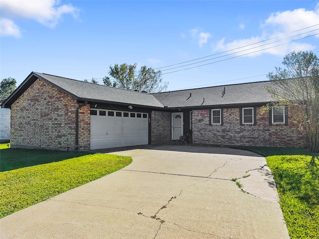 single story home featuring a front yard and a garage