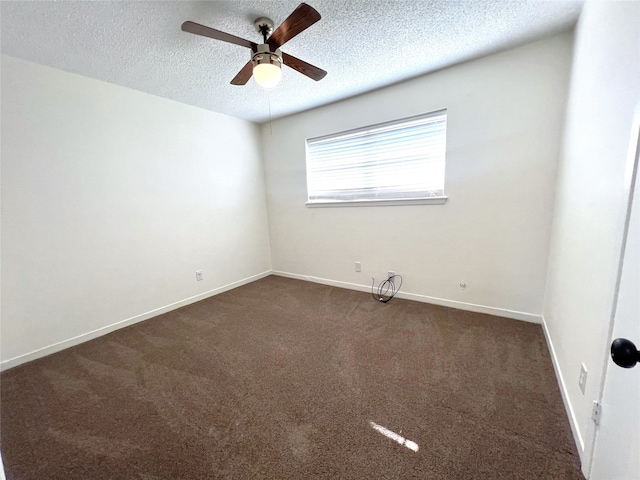 carpeted spare room featuring a textured ceiling and ceiling fan