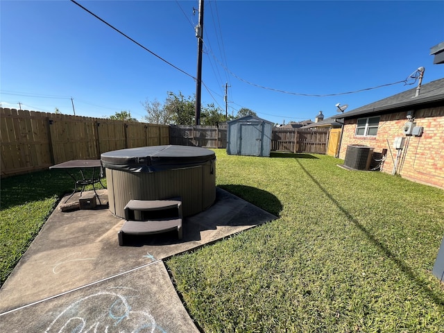 view of yard featuring a patio, a storage shed, a hot tub, and central air condition unit