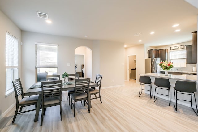 dining area with light wood-type flooring