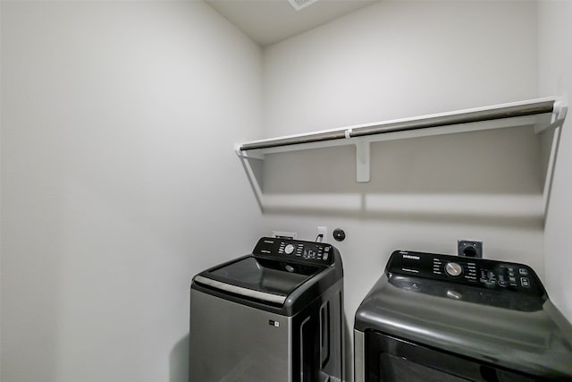 washroom with separate washer and dryer