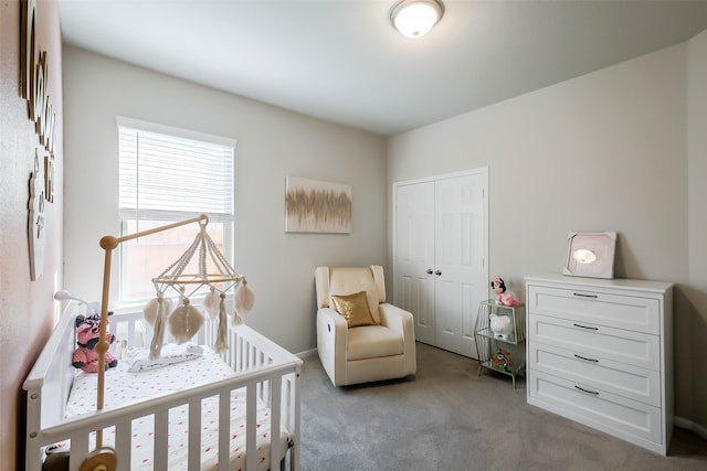 bedroom with a closet and light carpet