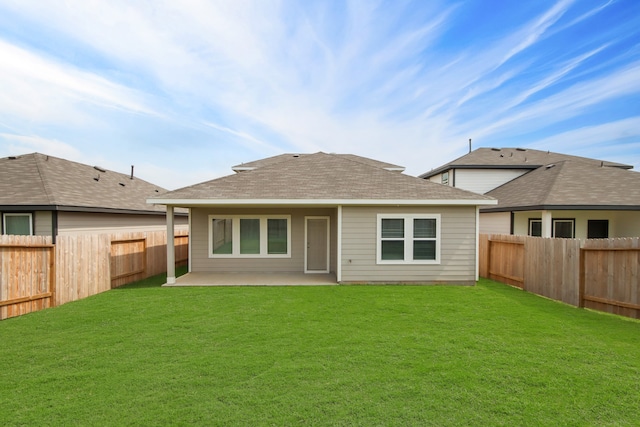 back of property featuring a patio and a yard