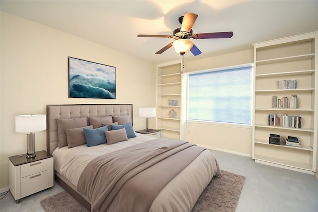 bedroom featuring light carpet, a ceiling fan, and baseboards