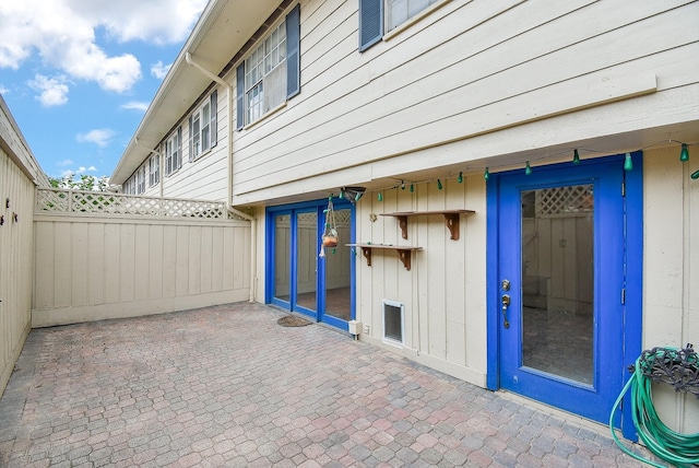 exterior space featuring a patio area and fence