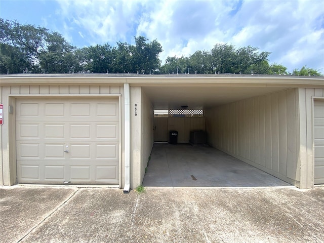 garage featuring a carport