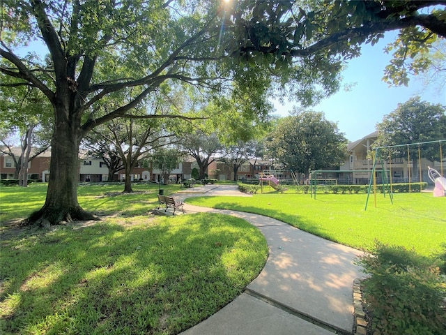 view of community with a playground and a lawn