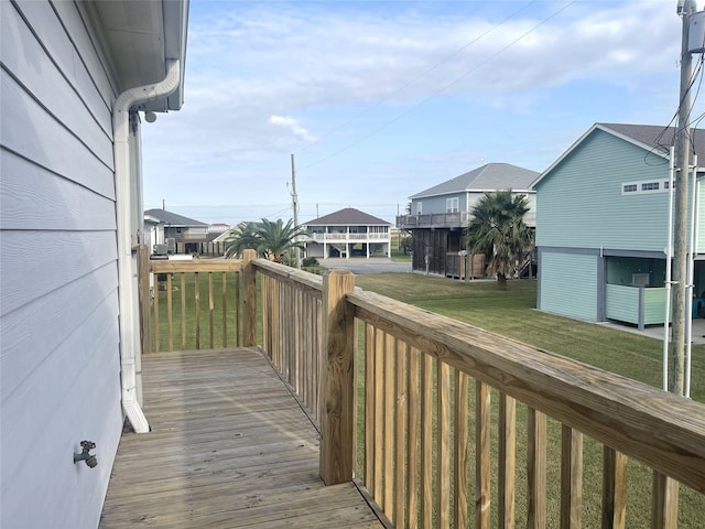 wooden deck with a lawn