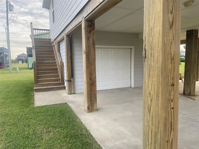 exterior space featuring wood walls and a lawn