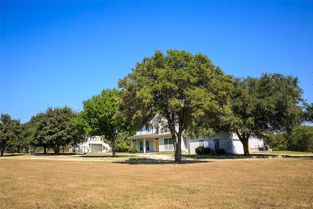 view of front facade with a porch and a front yard