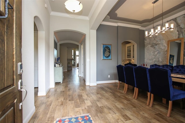 foyer featuring light hardwood / wood-style flooring and ornamental molding