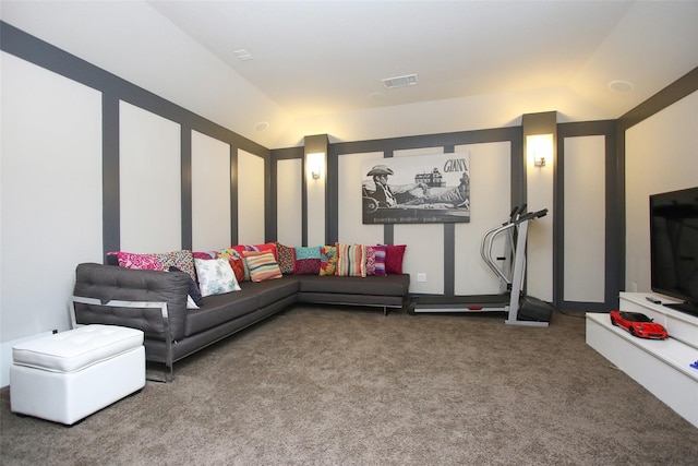 carpeted living room featuring vaulted ceiling