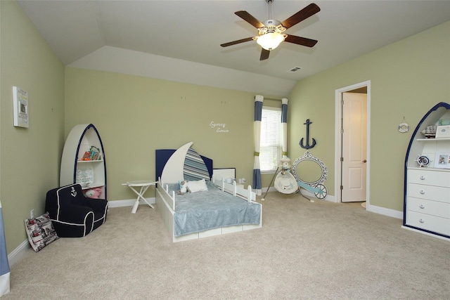 carpeted bedroom featuring vaulted ceiling and ceiling fan