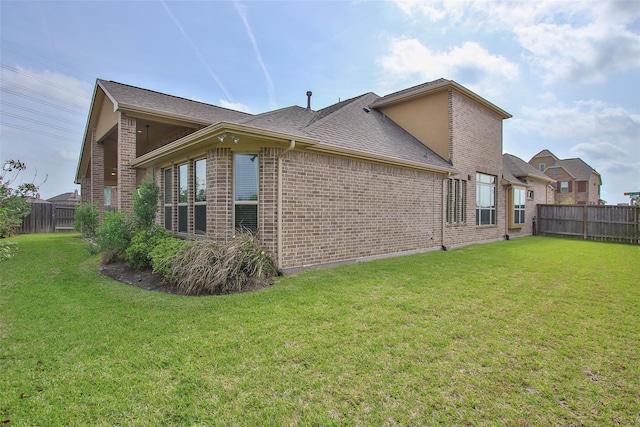 view of property exterior featuring a yard