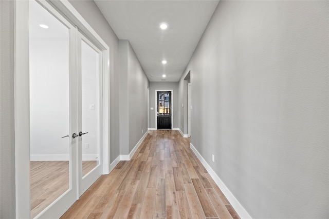 hallway with light wood-type flooring