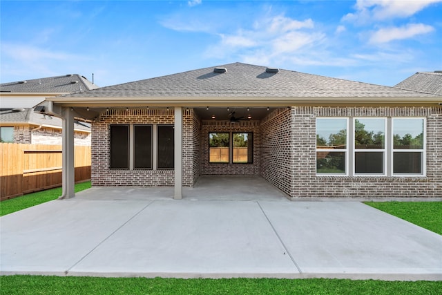 rear view of house featuring a patio area and ceiling fan