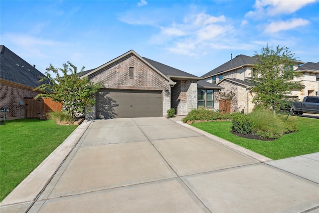 view of front of house with a front yard and a garage