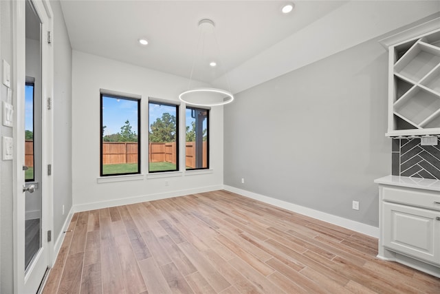 spare room with light wood-type flooring