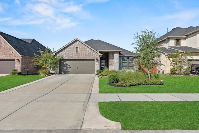 view of front of home with a garage and a front lawn