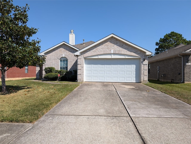 ranch-style house featuring a front yard and a garage