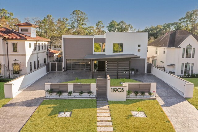 modern home featuring a front lawn