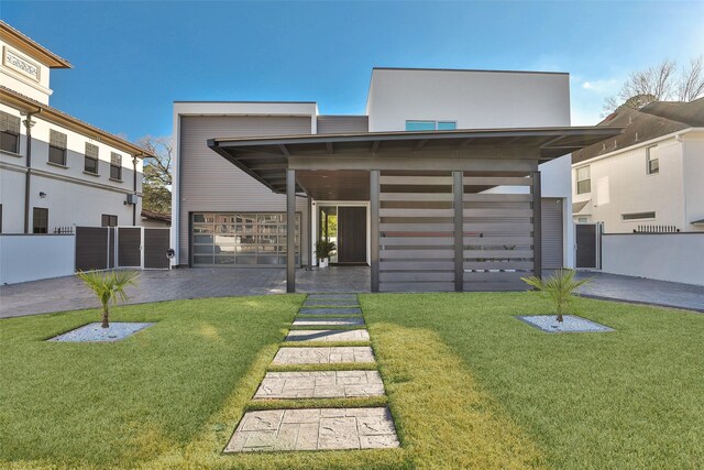 view of front facade with a carport and a front yard