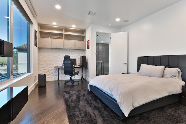 bedroom featuring dark hardwood / wood-style flooring