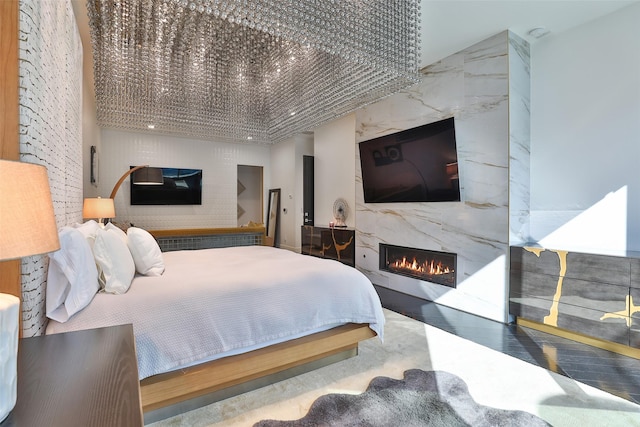 bedroom featuring a high end fireplace