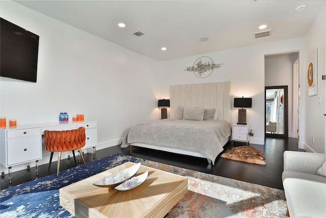 bedroom with dark wood-type flooring