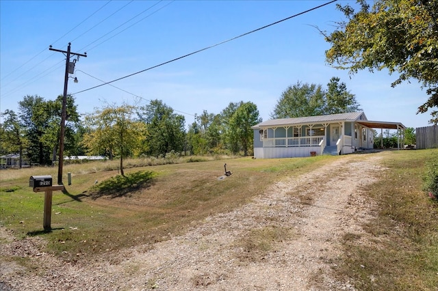 view of front of home featuring a front lawn and a porch