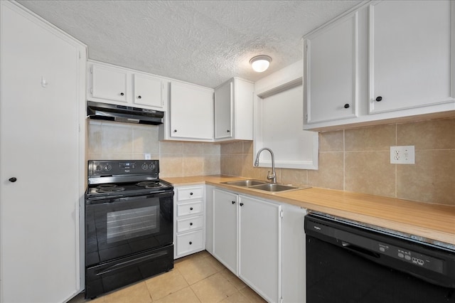 kitchen with sink, black appliances, white cabinets, and decorative backsplash