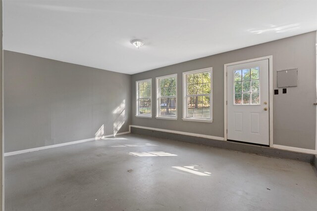 spare room featuring concrete flooring