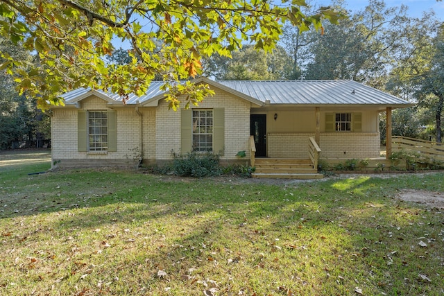 ranch-style home featuring a porch and a front yard