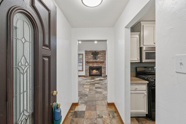 foyer with a fireplace