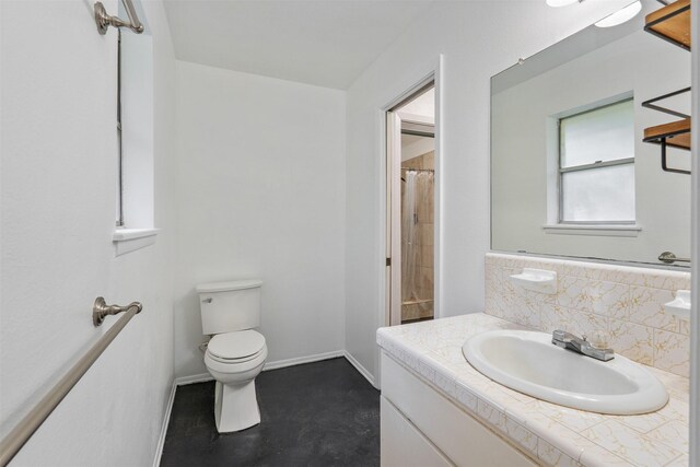 bathroom featuring vanity, a shower with curtain, and toilet