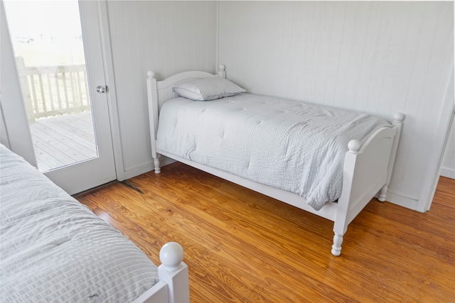 bedroom with hardwood / wood-style flooring