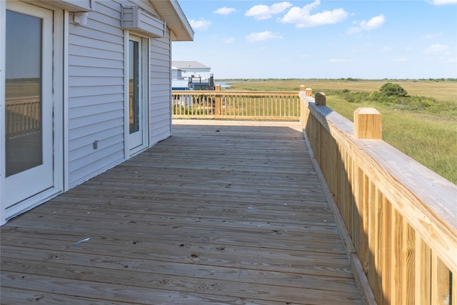 wooden terrace featuring a rural view