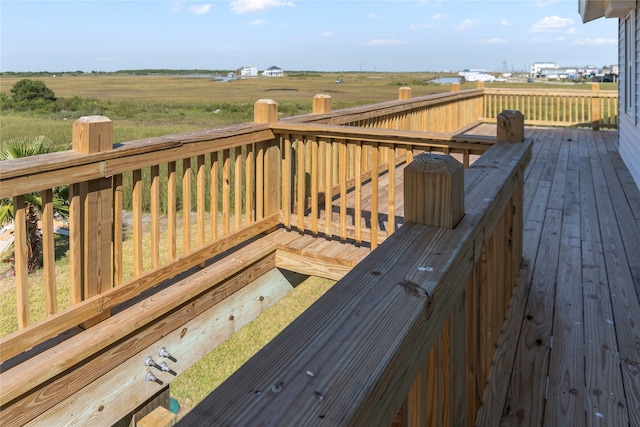 wooden deck featuring a rural view