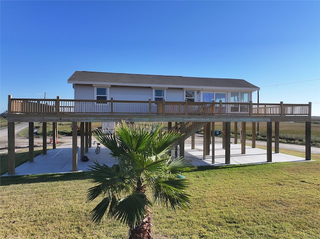 dock area featuring a yard, a patio area, and a deck