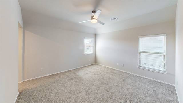 carpeted empty room featuring ceiling fan