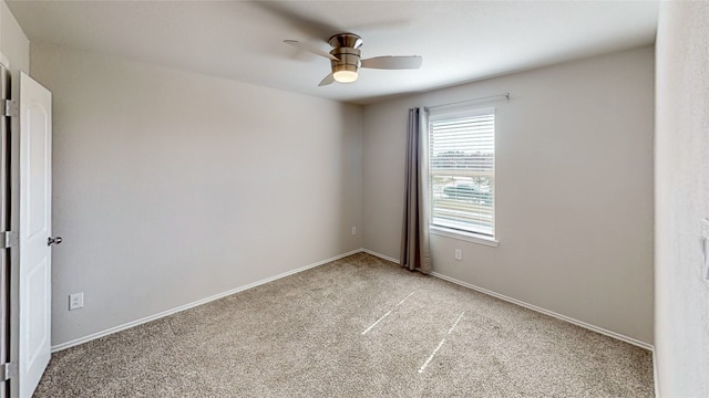 empty room featuring light carpet and ceiling fan