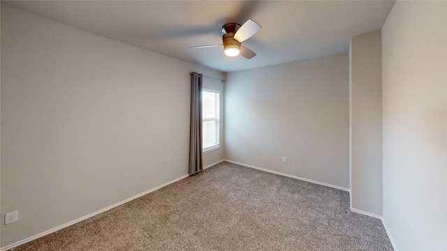 unfurnished room with ceiling fan and light colored carpet