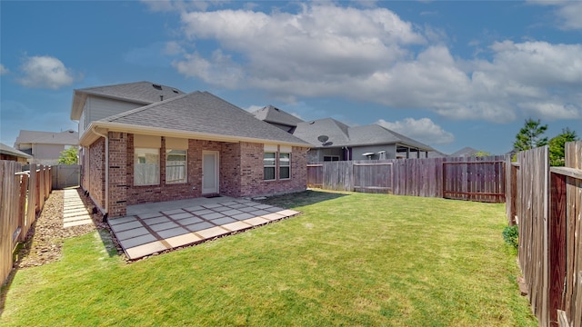 back of property featuring a patio area and a lawn