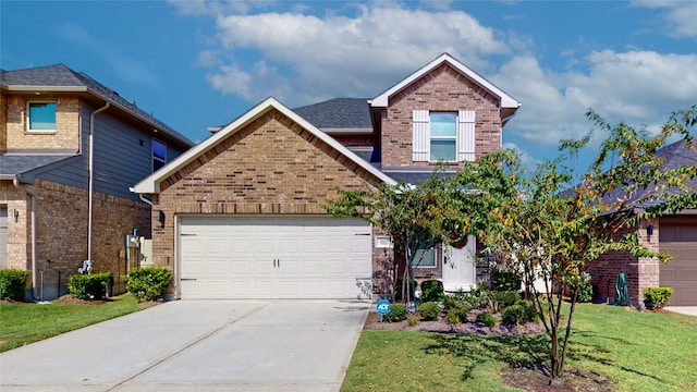 view of front facade with a garage and a front lawn