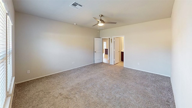 unfurnished bedroom with light colored carpet and ceiling fan