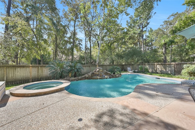 view of swimming pool with a patio and an in ground hot tub