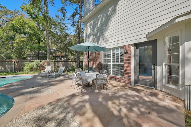 view of patio with a fenced in pool