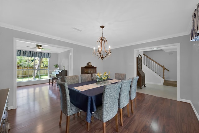 dining room with ornamental molding, dark wood-type flooring, and ceiling fan with notable chandelier