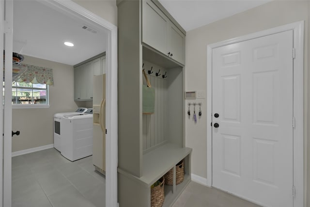 mudroom with washer / dryer and light tile patterned flooring